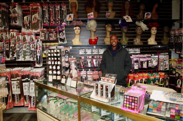 Tomas Eurico shows off some of the many hair products offered at the new mall business, Beurico Beauty Supply, which opened at Westland Mall Saturday, Nov. 5. There are wigs, hair extensions, a variety of shampoos, catering to men and women alike of various ethnicities. Photo/Chris Faulkner